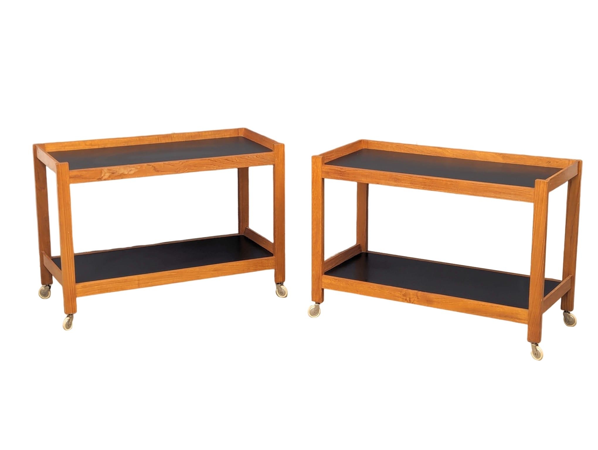 A pair of Mid Century teak 2 tiered trollies. 89.5x40x63.5cm