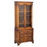 A Georgian style mahogany bookcase with brushing slide and astragal glazed doors. 75x40x176.5cm