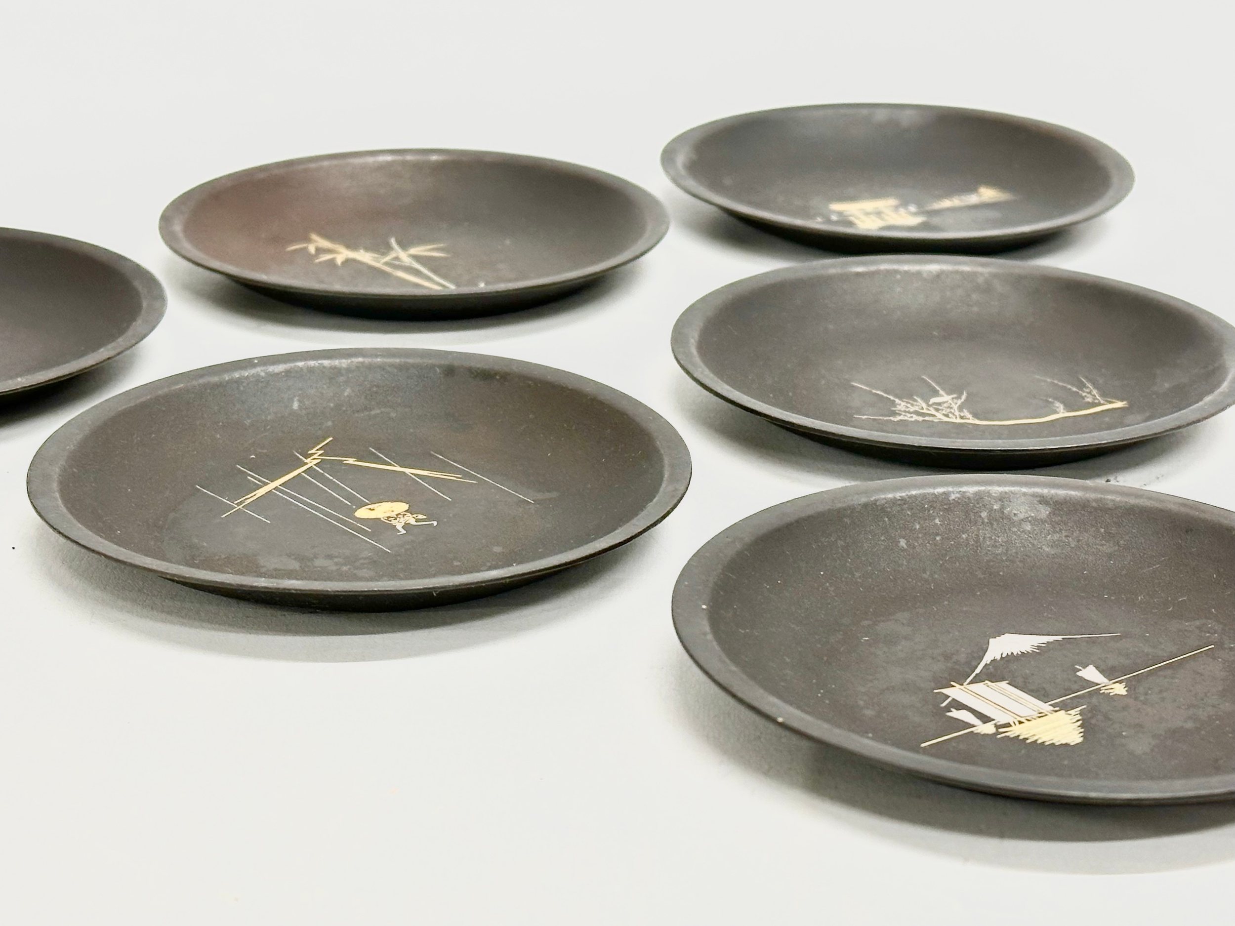 An excellent set of 6 signed Japanese Meiji period Amita gold and silver inlaid iron dishes. 10cm - Image 9 of 10