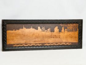 A large Early 20th Century pokerwork wall plaque. 113x43cm