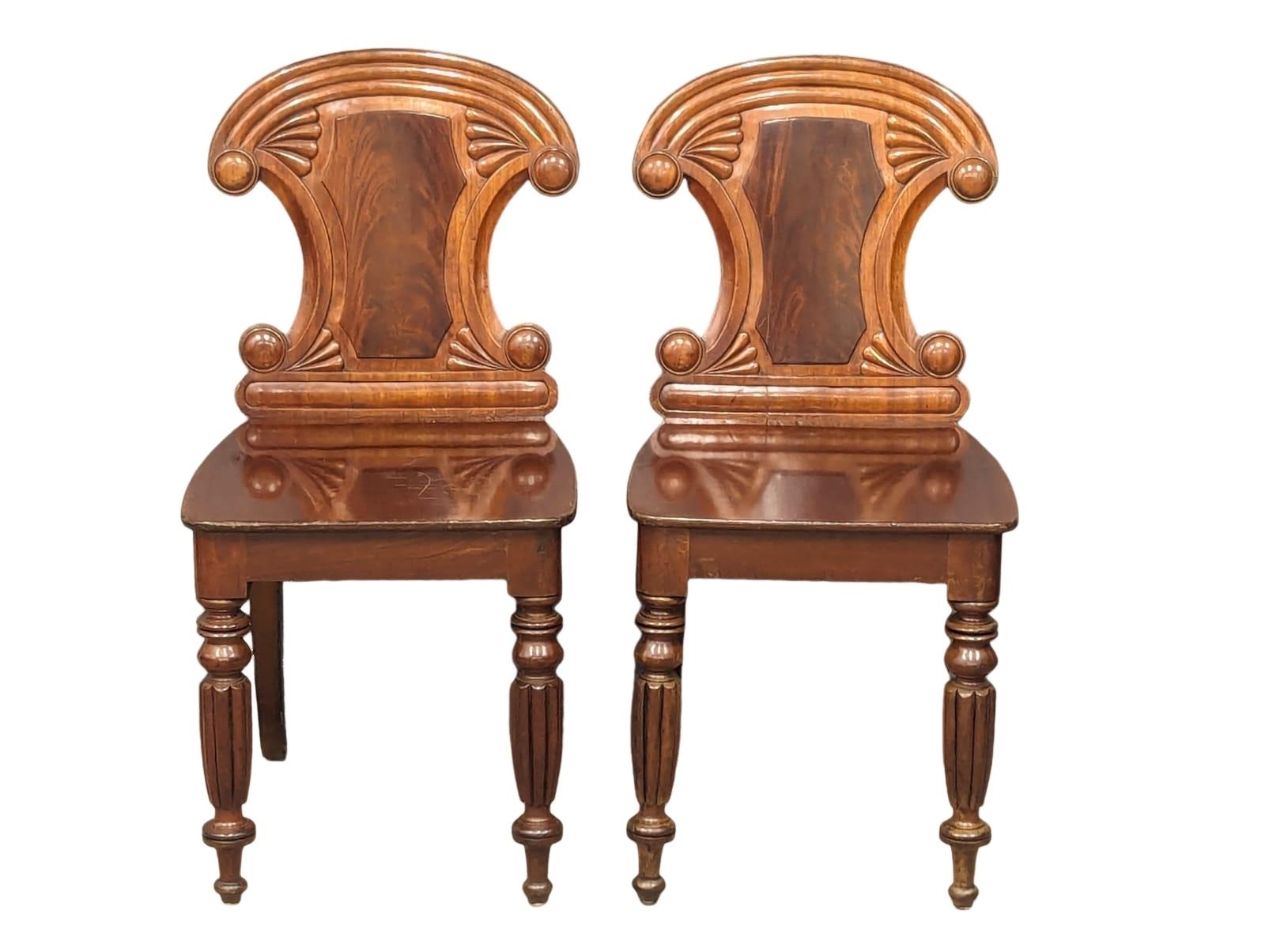 A pair of late George IV-Early William IV ornate mahogany hall chairs - Image 5 of 6