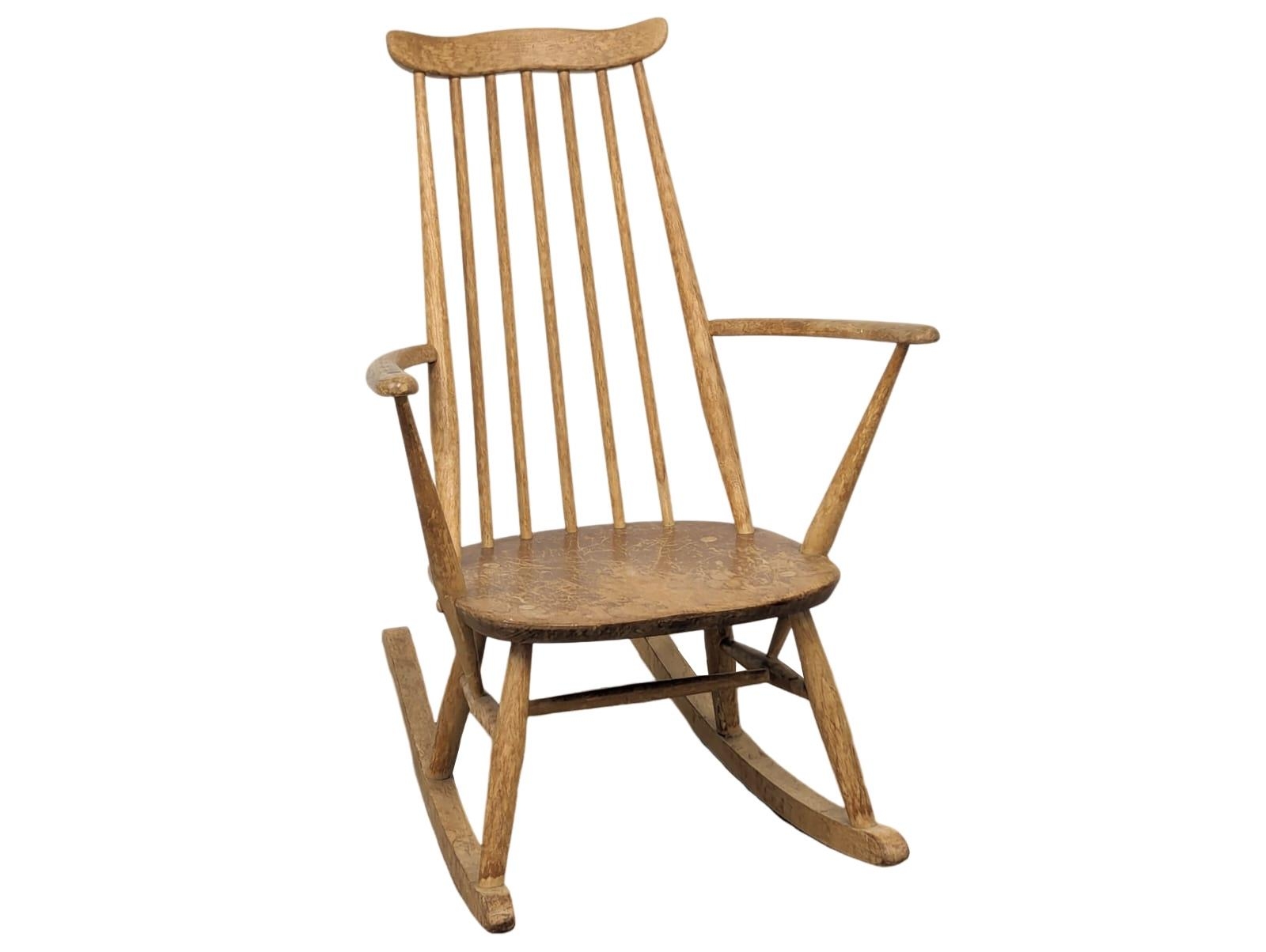 An Ercol Mid Century blonde elm and beech rocking chair