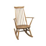 An Ercol Mid Century blonde elm and beech rocking chair
