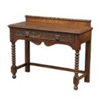 A late Victorian carved oak hall table with bobbin turn legs and Man Of The Forest handles, 107cm