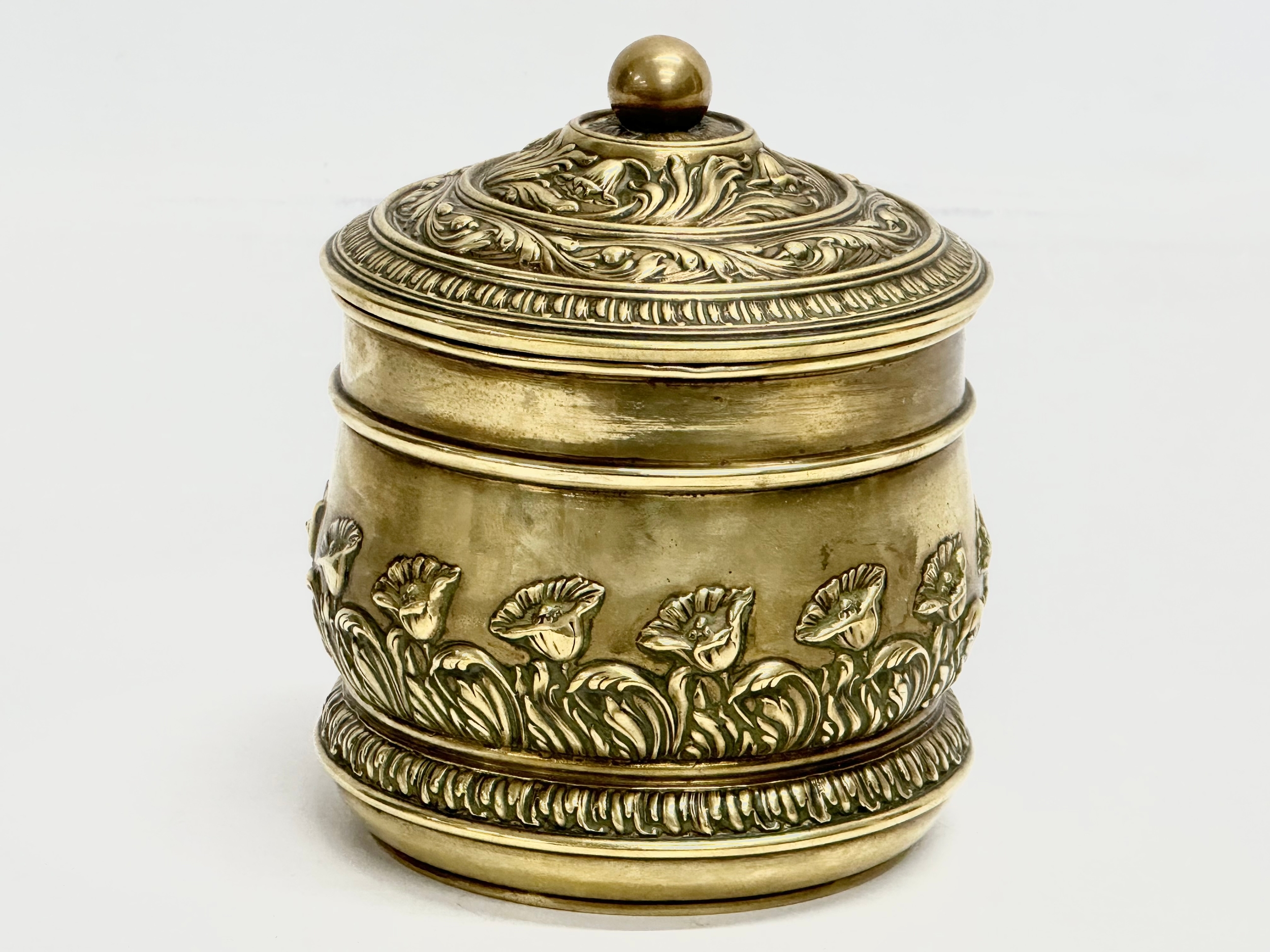 A Late 19th Century brass tobacco jar with lid. 11x13cm