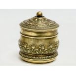 A Late 19th Century brass tobacco jar with lid. 11x13cm