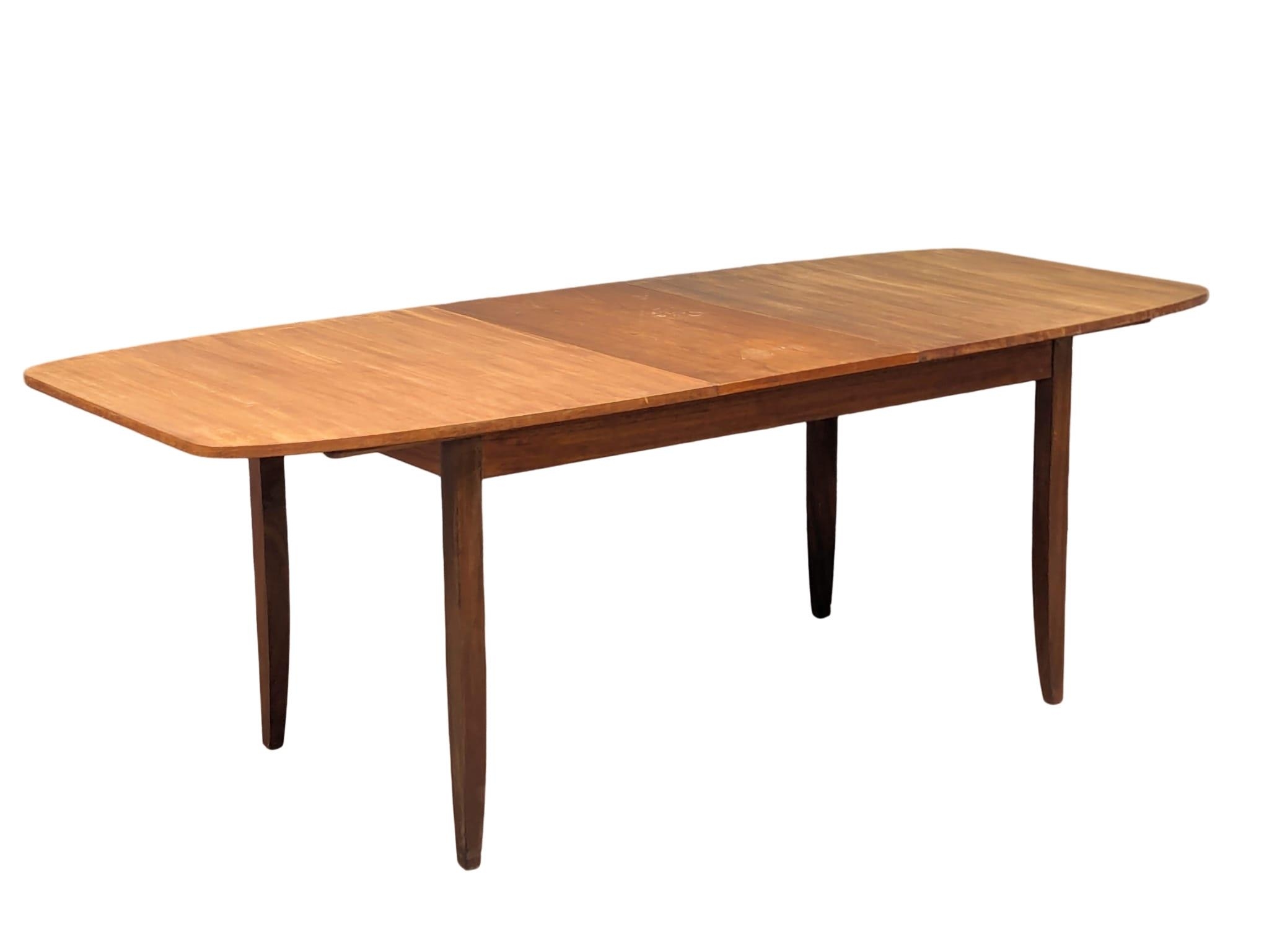 A mid century teak table and 6 chairs, 168cm x 89cm x 75cm. Extended 211cm x 89cm x 75cm - Image 16 of 17