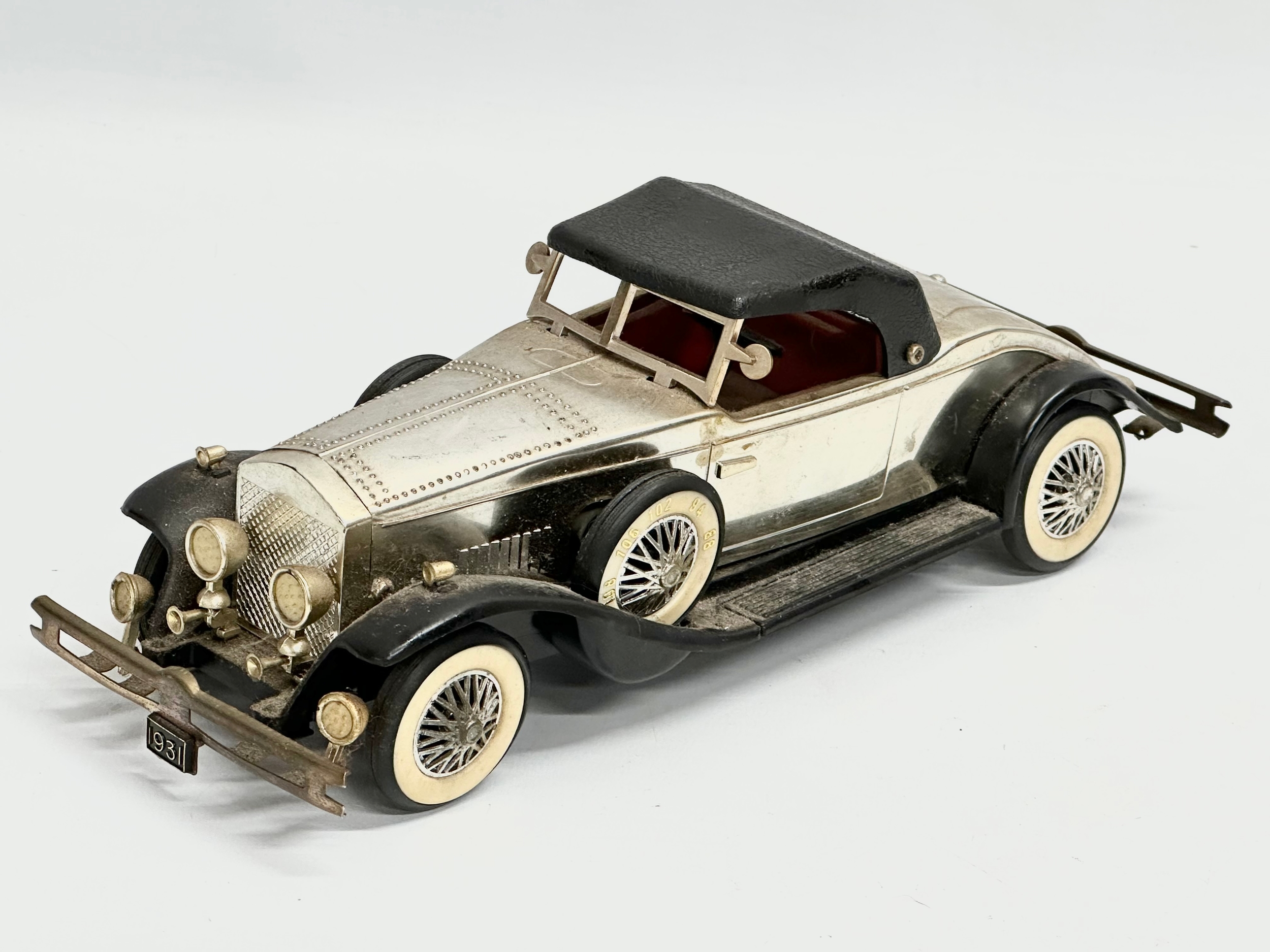 A vintage Rolls Royce Phantom battery operated car. 25cm