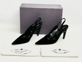 A pair of Parada slingback heels with box and covers. 39.