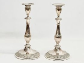 A pair of silver plated candlesticks. 28cm