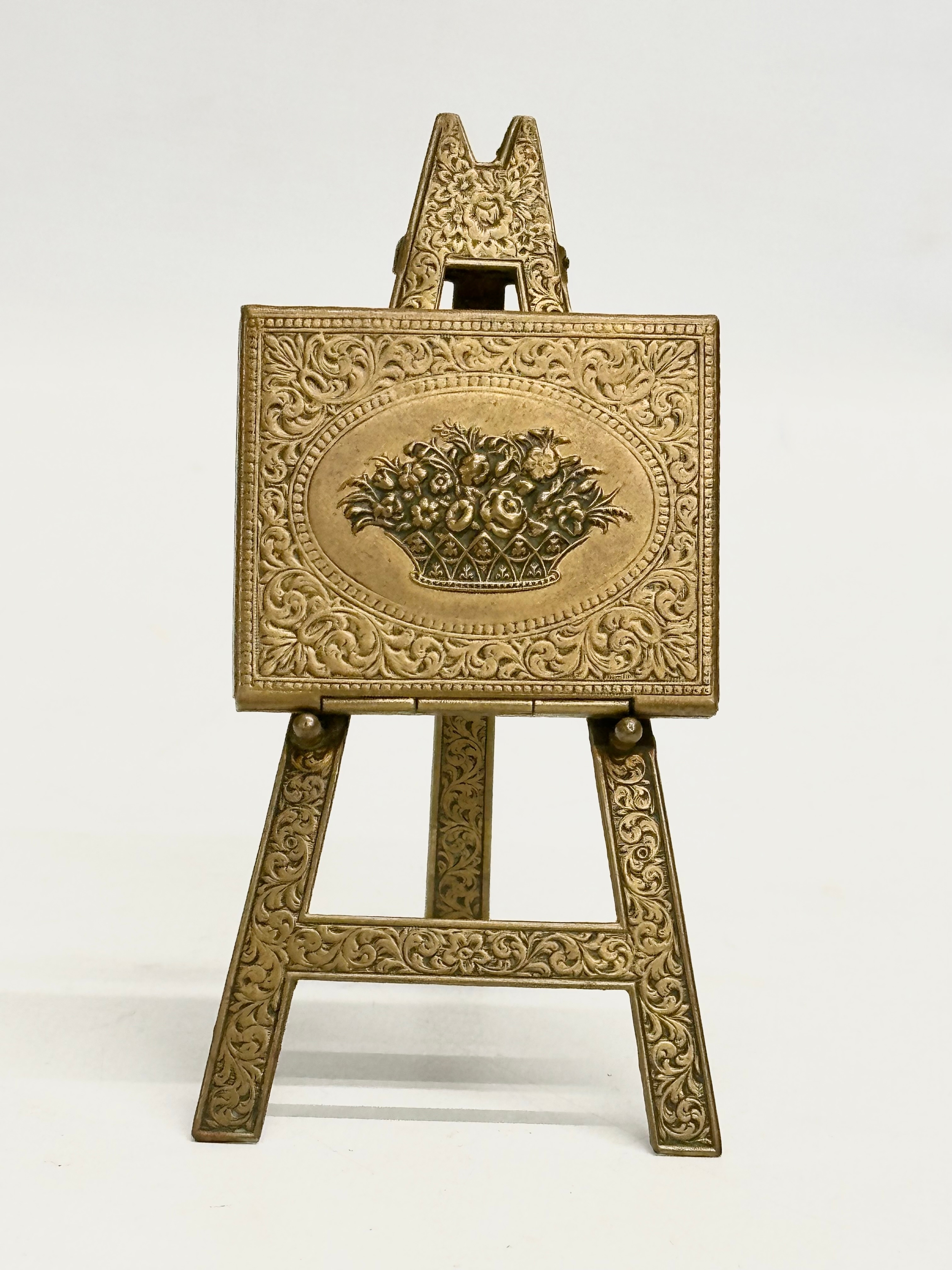 A Late 19th Century Victorian W. Whiteley brass easel needle case. 11cm