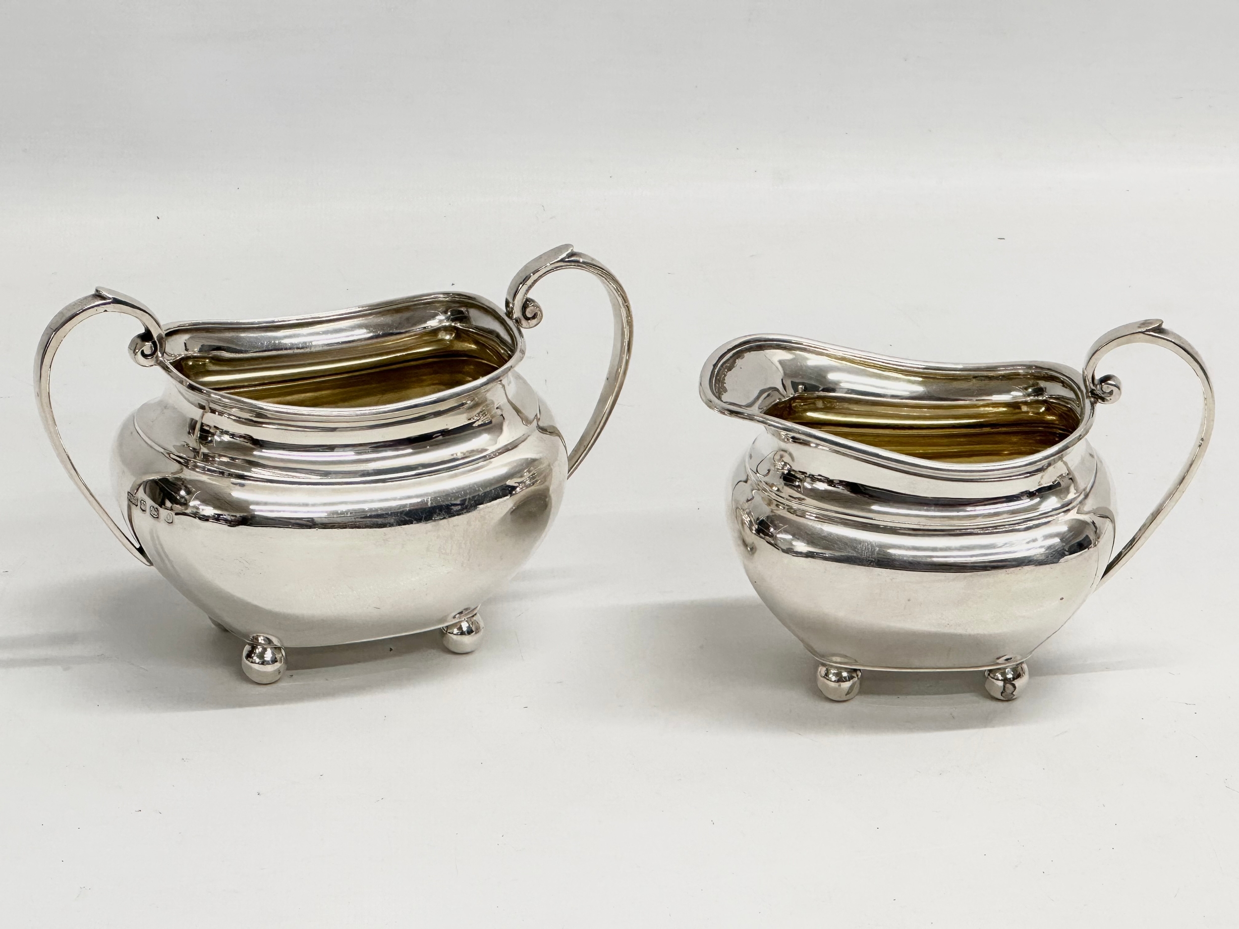 Silver cream and sugar bowls. Sheffield 1931. 287.27 grams.