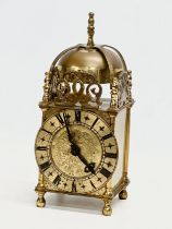 A vintage 18th century style brass mantle clock by Smiths. 10x10x25cm