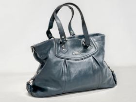 A Coach Ashley leather handbag.