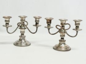 A pair of good quality Edwardian silver plated candelabras. 24x19.5cm