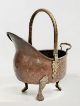 An Early 20th Century copper and brass coal scuttle. Circa 1900. 24x38x34cm