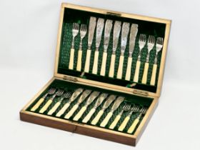 A Late 19th Century silver mounted cutlery set in mahogany case. 39.5x26.5x6.5cm