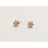 A pair of 18ct gold earrings. 0.28g