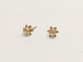 A pair of 18ct gold earrings. 0.28g