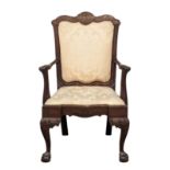 A good quality ornate George II mahogany armchair on ball and claw feet. With Chinese style