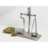 A Co-Operative Wholesale Society balance scales with brass weights. 51x26x54cm