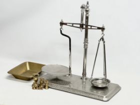 A Co-Operative Wholesale Society balance scales with brass weights. 51x26x54cm
