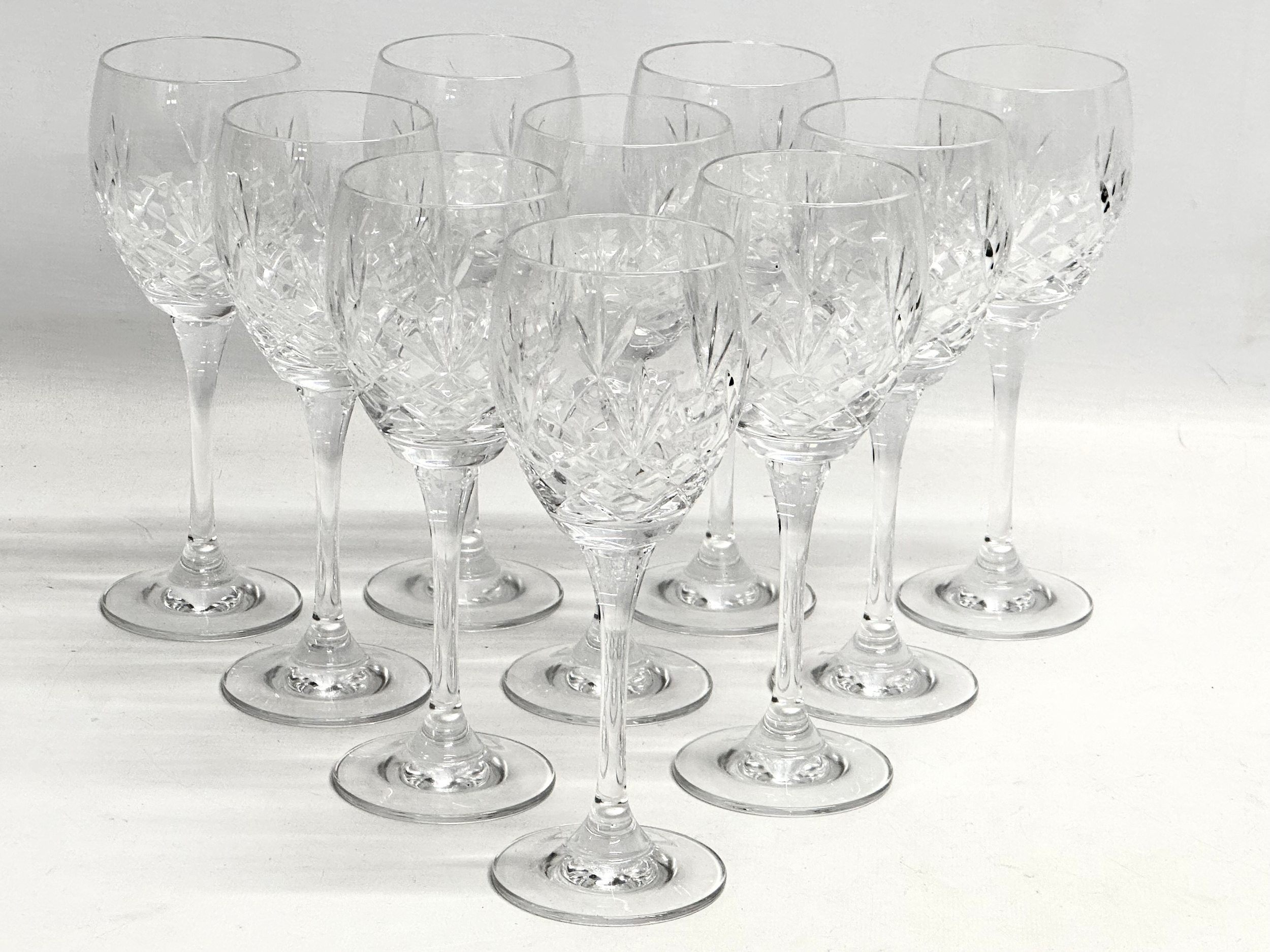 A set of 10 crystal wine glasses. 19cm
