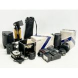 A collection of camera equipment. Yashica lens, flash etc. Subagor camera stand and other. Super