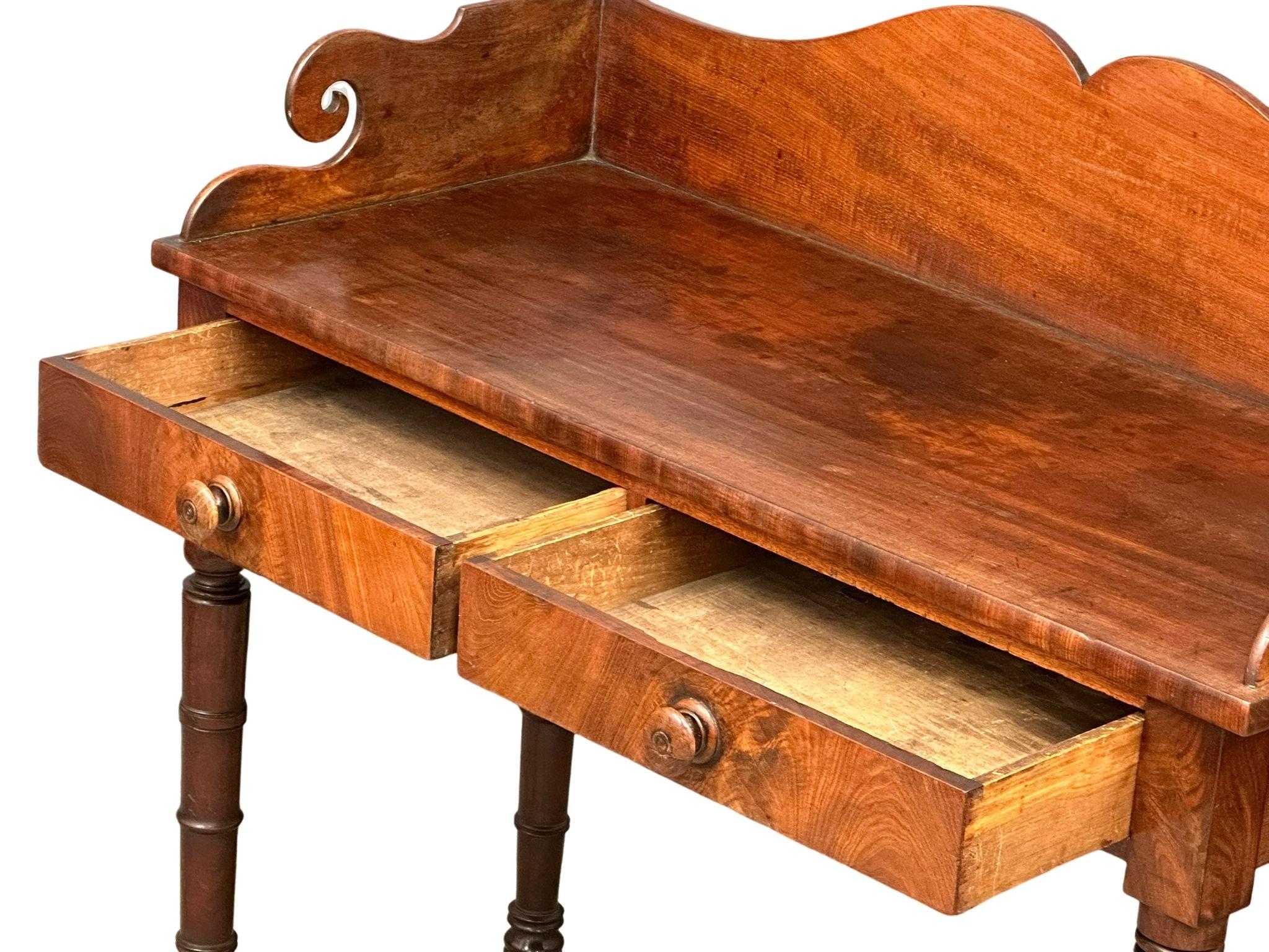 A late George IV mahogany gallery back side table on reeded legs, containing 2 front facing drawers. - Image 3 of 10