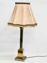 A large vintage brass table lamp with Corinthian style column. Base measures 17x17x74cm.