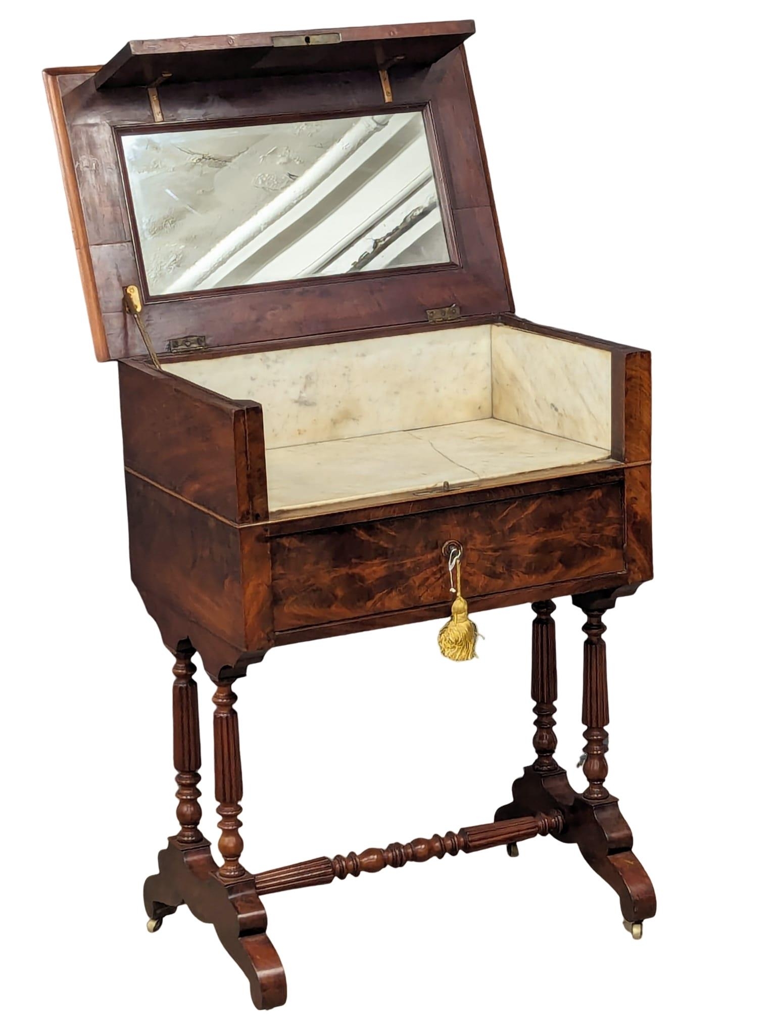 A 19th Century French mahogany washstand / dressing table on reeded turned legs and stretcher. Circa - Image 2 of 7