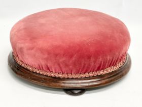 A Victorian mahogany framed footstool. 33x12cm