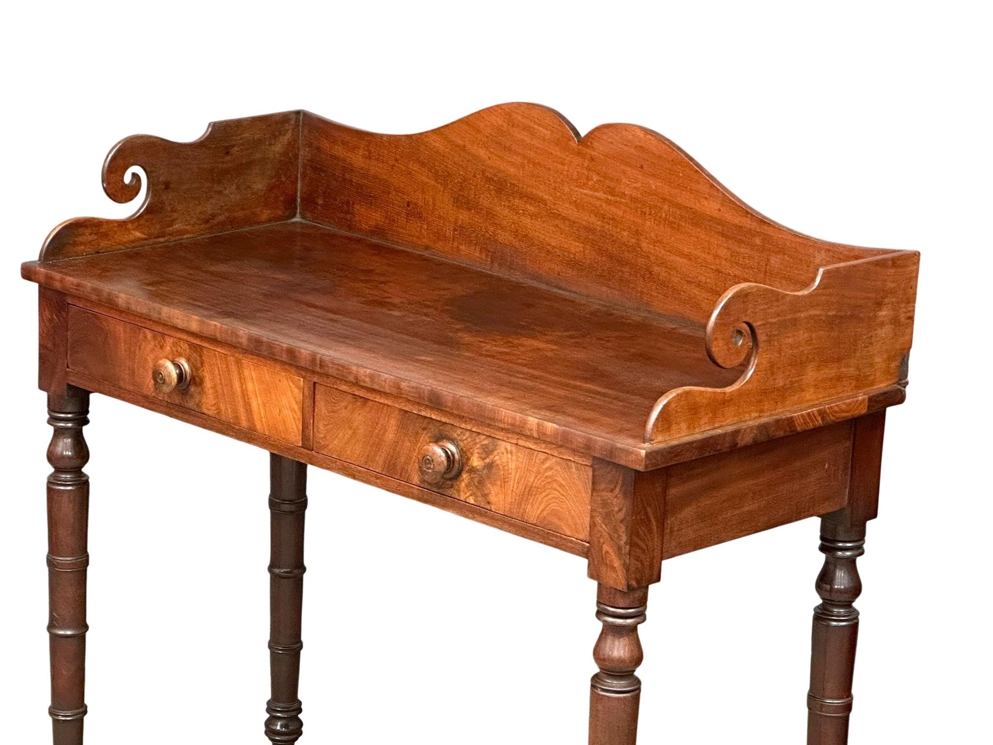 A late George IV mahogany gallery back side table on reeded legs, containing 2 front facing drawers. - Image 7 of 10