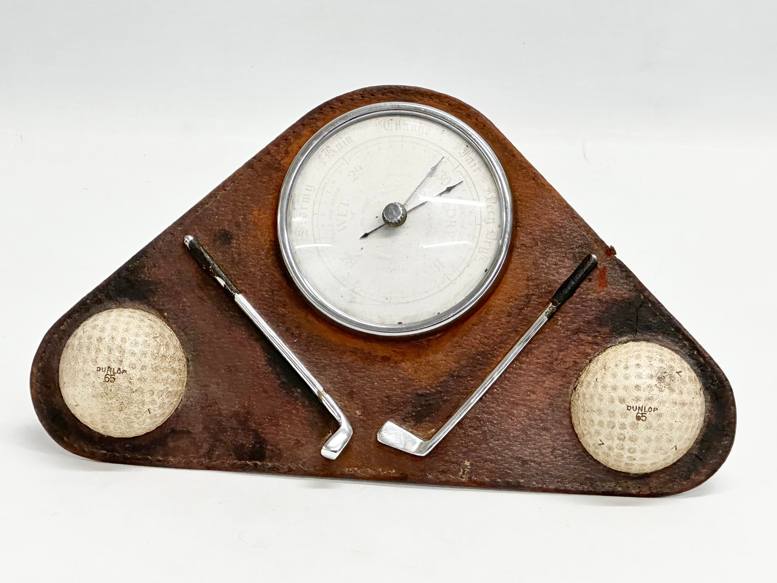 A vintage Enbeeco ‘Golf’ barometer. 23x13cm