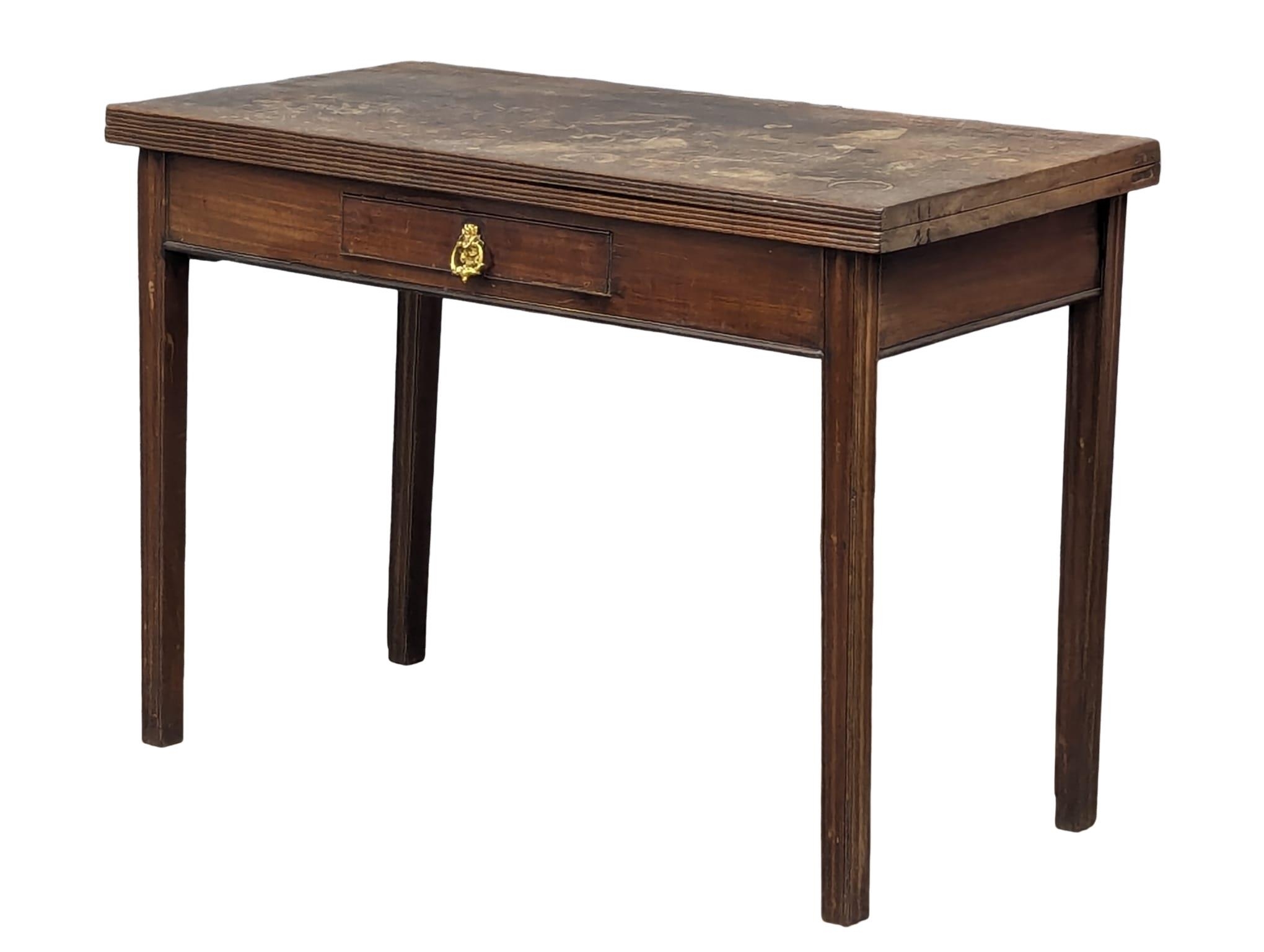 A George III mahogany tea table with drawer and square tapering legs, 109cm x 52.5cm x 76cm