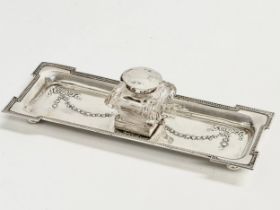 An Early 20th Century silver pen and ink stand. Birmingham 1910. Stand weighs 144.47 grams. 23cm