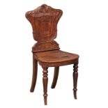 An early William IV ornate mahogany hall chair