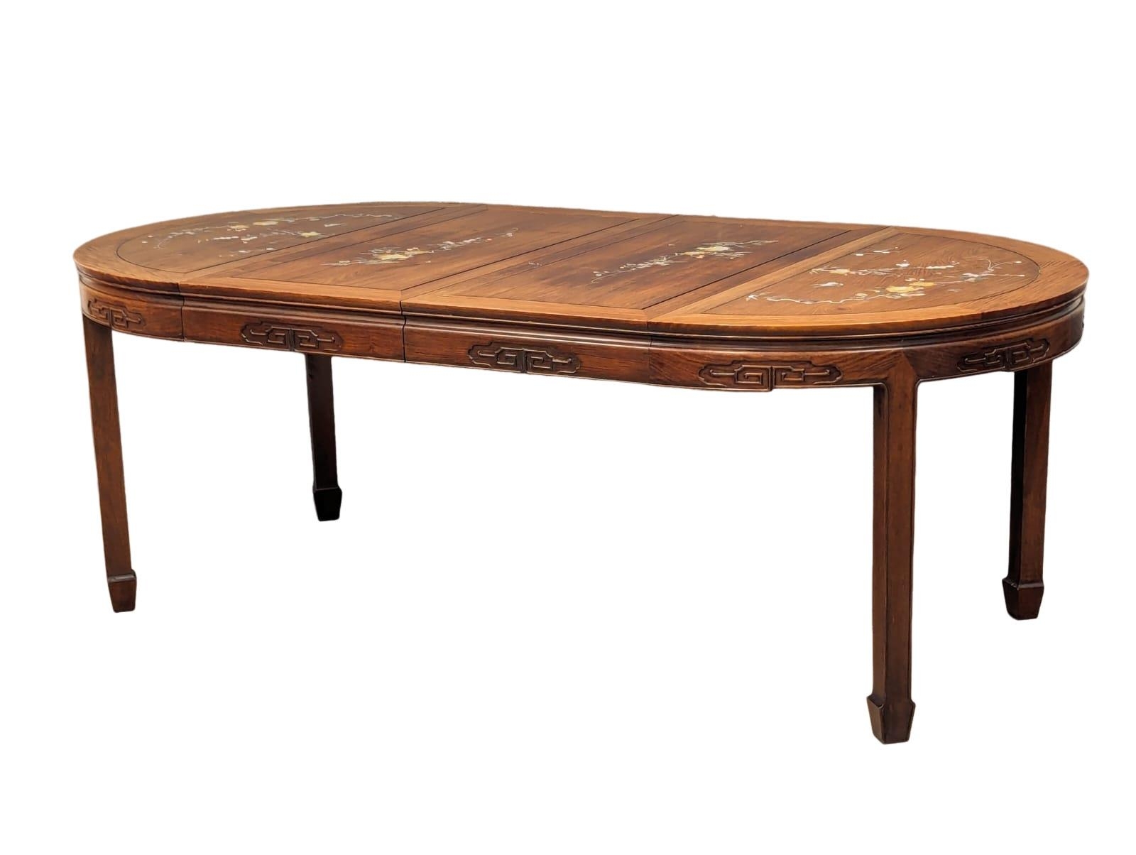 A Chinese rosewood 2 leaf extending dining table and 6 chairs with Mother of Pearl inlay. - Image 10 of 11