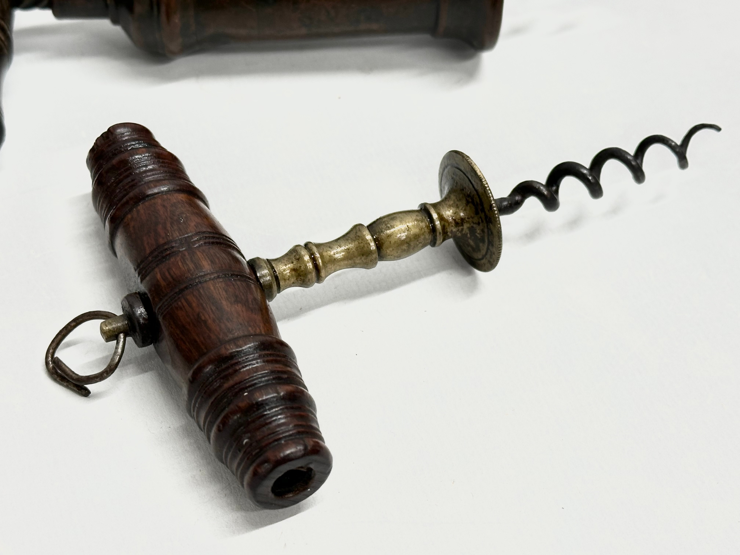 A good collection of 19th Century corkscrews with turned handles. A large barrel shaped corkscrew - Image 2 of 9