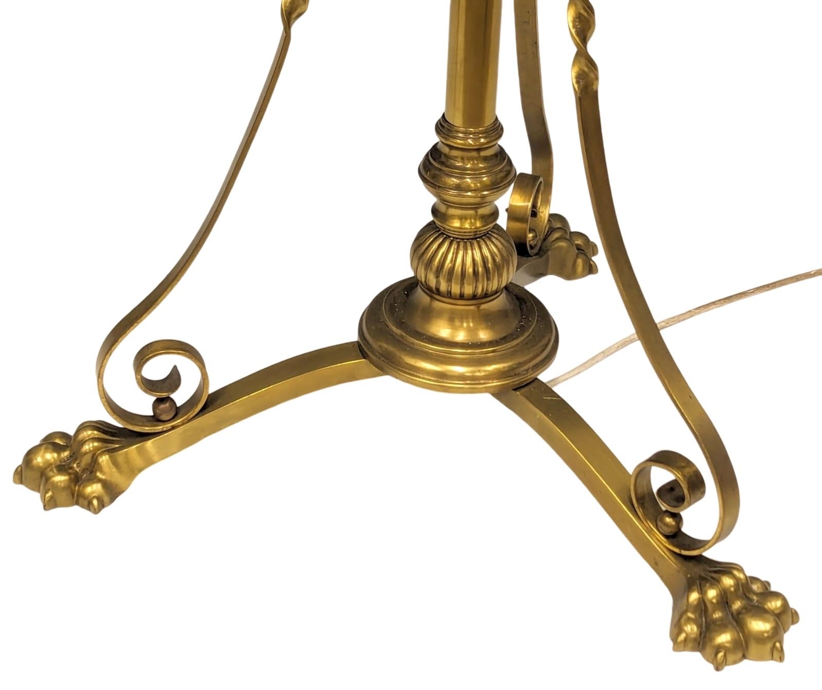 A large Early 20th Century telescopic brass standard lamp on brass lion paw feet. 180cm - Image 2 of 3