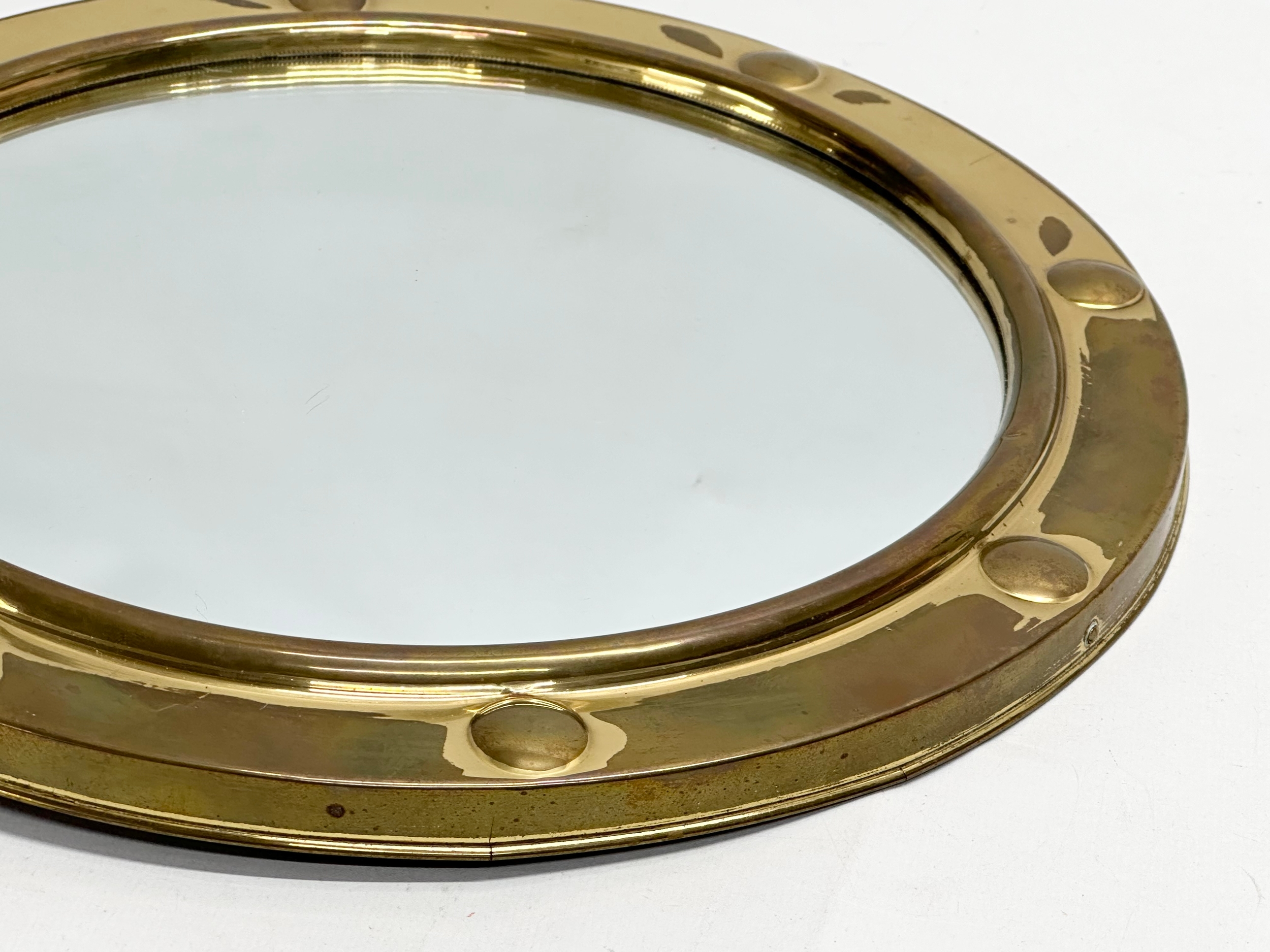 A Mid 20th Century brass framed ships porthole style convex mirror. 30cm - Image 2 of 4