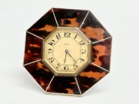 An Art Deco faux tortoiseshell 8 Day desktop clock. 10x10cm