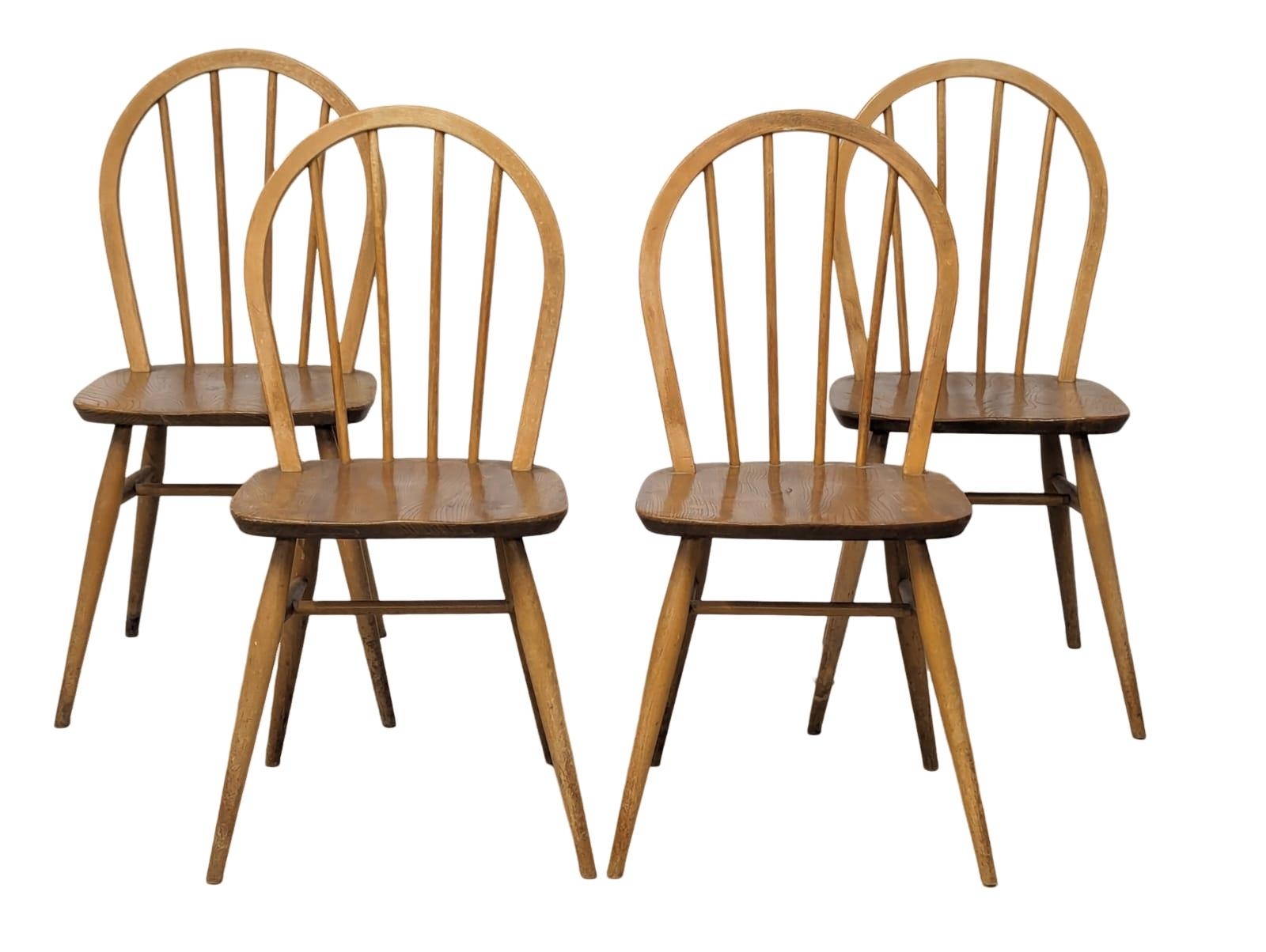 A set of 4 Ercol Model 400 Mid Century Blonde elm and beech dining chairs.