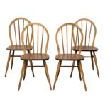 A set of 4 Ercol Model 400 Mid Century Blonde elm and beech dining chairs.