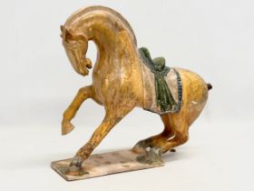 A 19th Century Chinese Tang glazed terracotta horse. 36x36cm