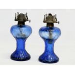 A pair of Early 20th Century Bristol Blue glass oil lamps. 22cm