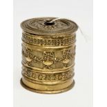 A Late 19th Century ornate brass string box. 9x10cm