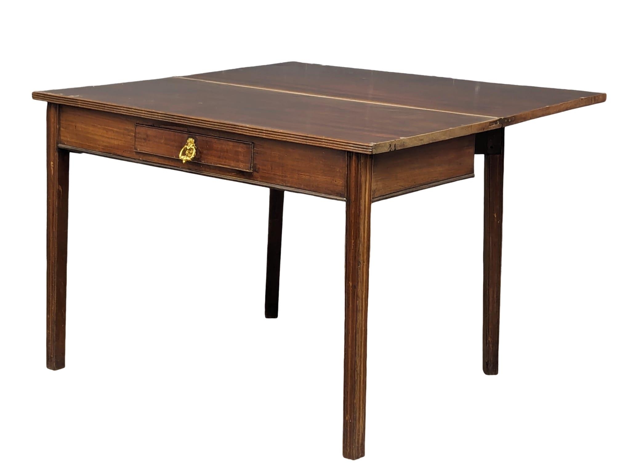 A George III mahogany tea table with drawer and square tapering legs, 109cm x 52.5cm x 76cm - Image 5 of 6