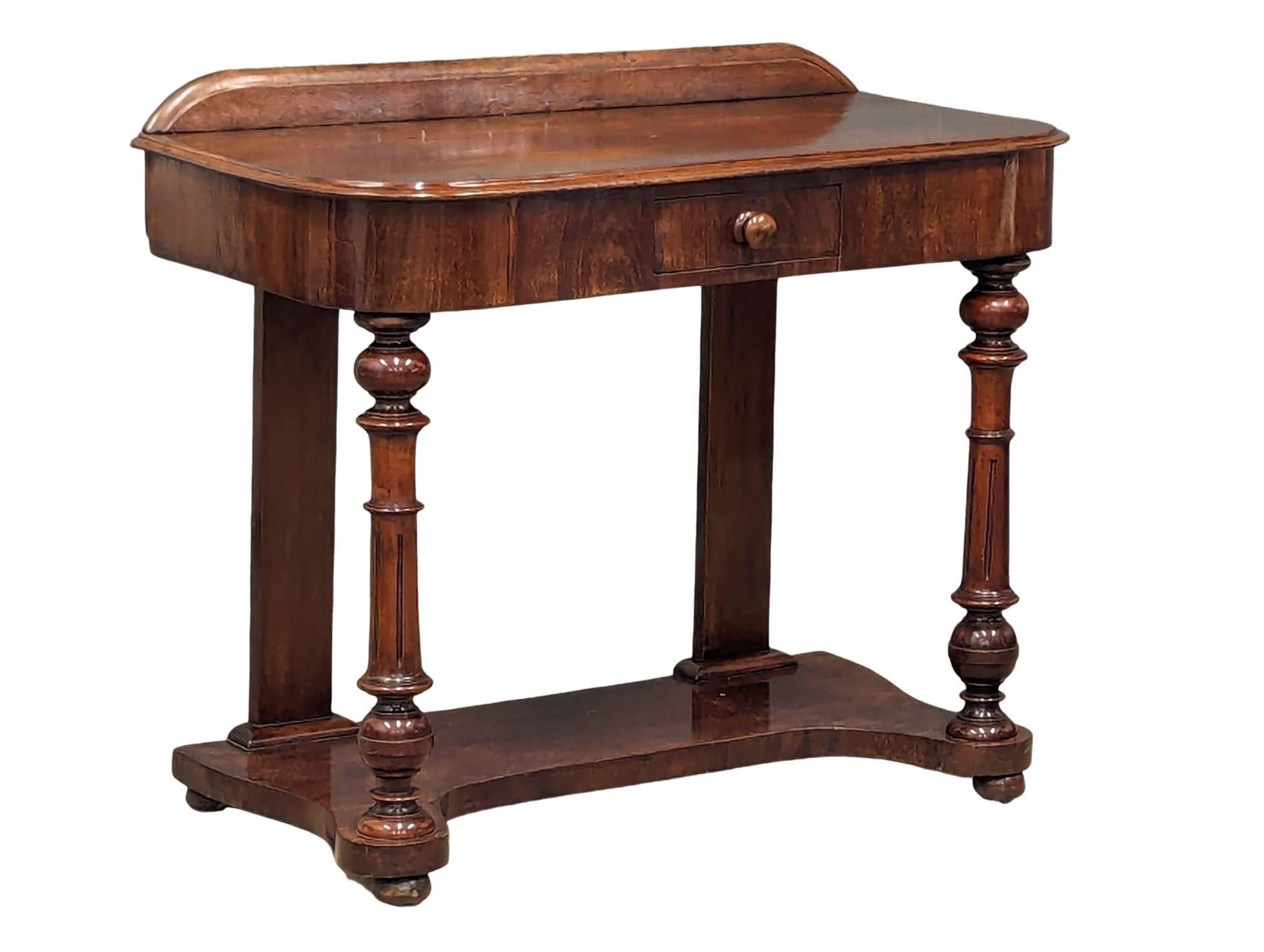 A Victorian mahogany hall table on turned supports and drawer, circa 1870s. 92cm x 45cm x 76cm