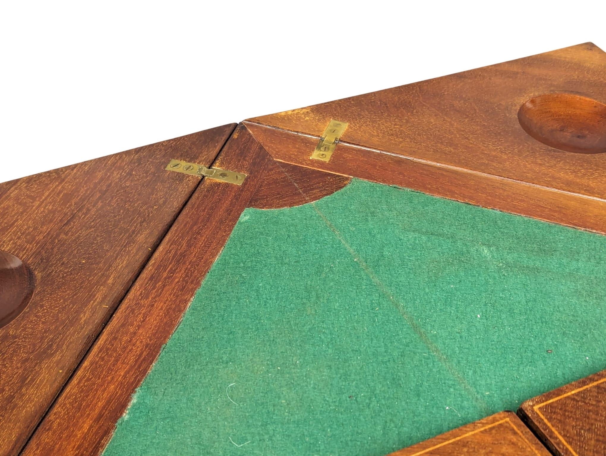 An Edwardian inlaid mahogany envelope turnover games table. 53.5x77.5cm - Image 4 of 8